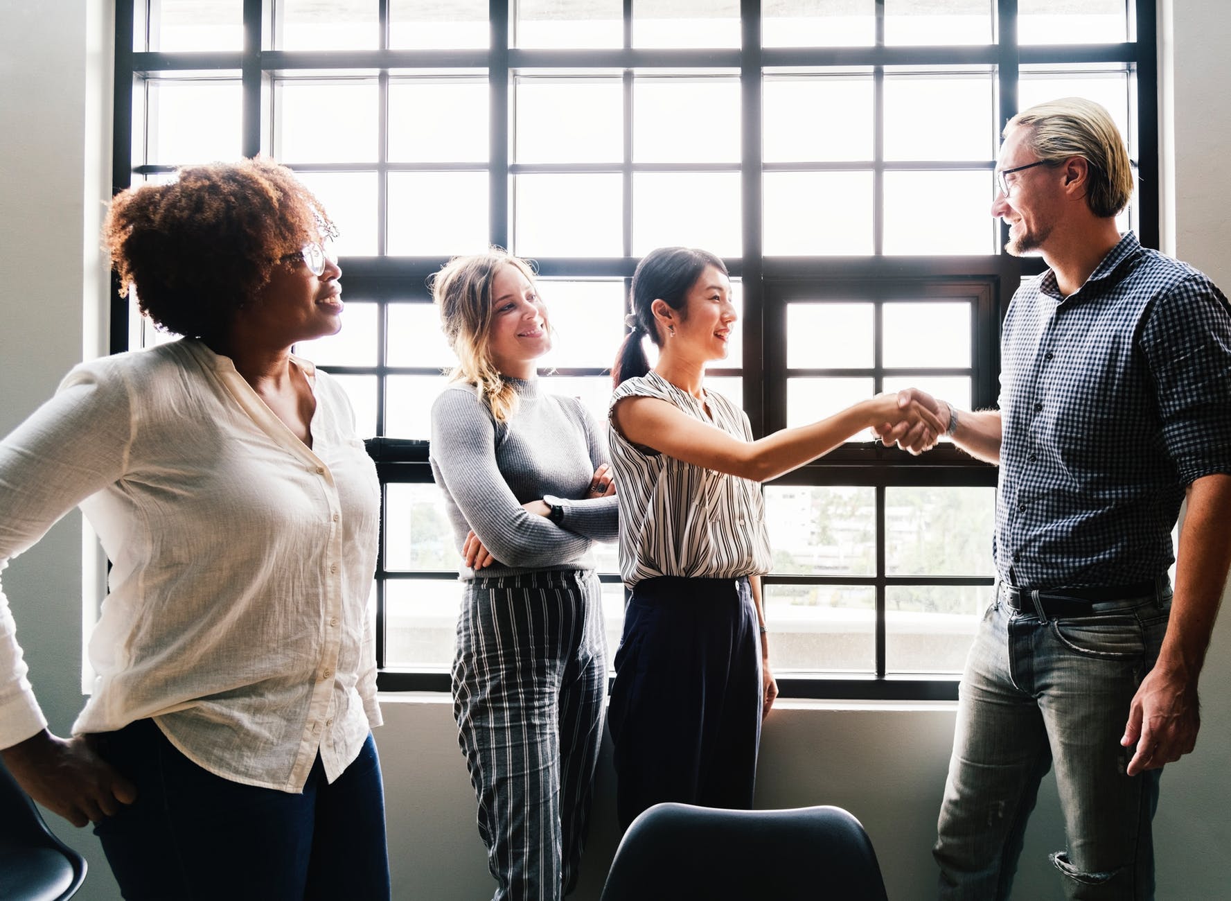 photo of a woman handshaking with a man