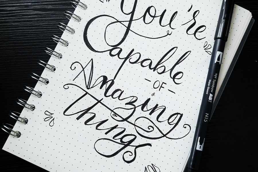 pen on you're capable of amazing things spiral notebook