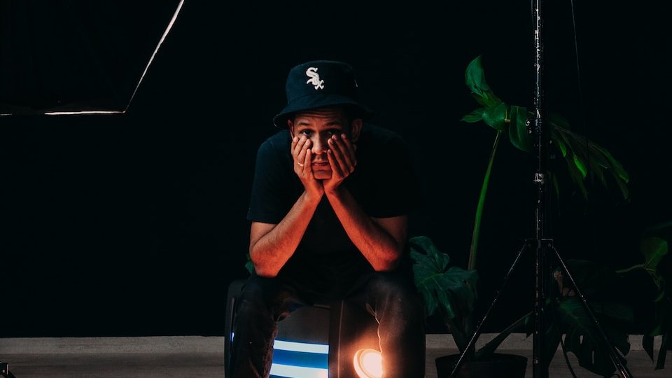 man in black and blue helmet and blue denim jeans