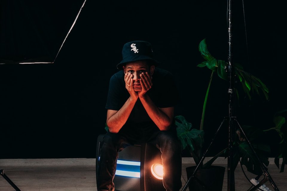 man in black and blue helmet and blue denim jeans