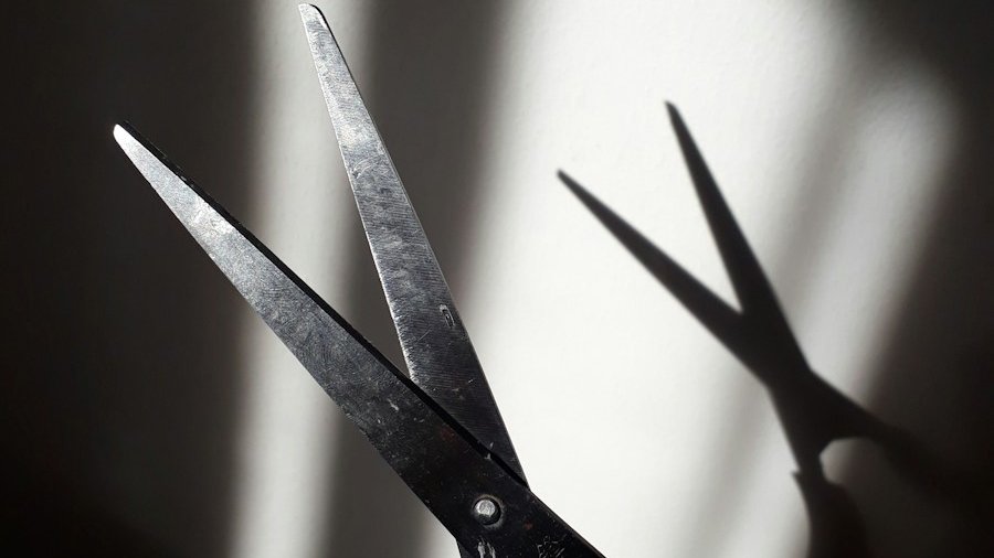 black handle scissors on white surface