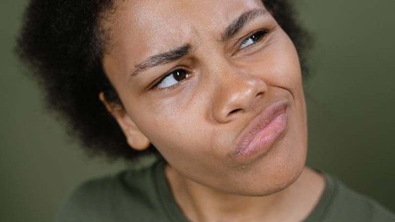 Woman in Green Shirt Thinking