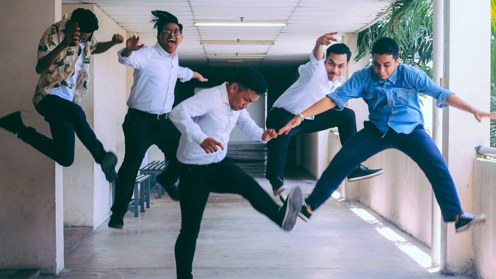 group of people doing jump shot photography