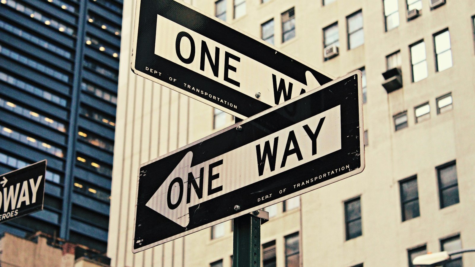 white and black One Way-printed road signages