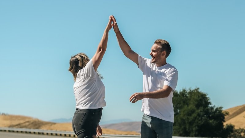 a man and a woman holding hands