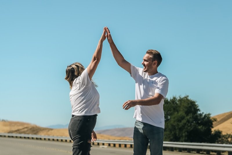a man and a woman holding hands