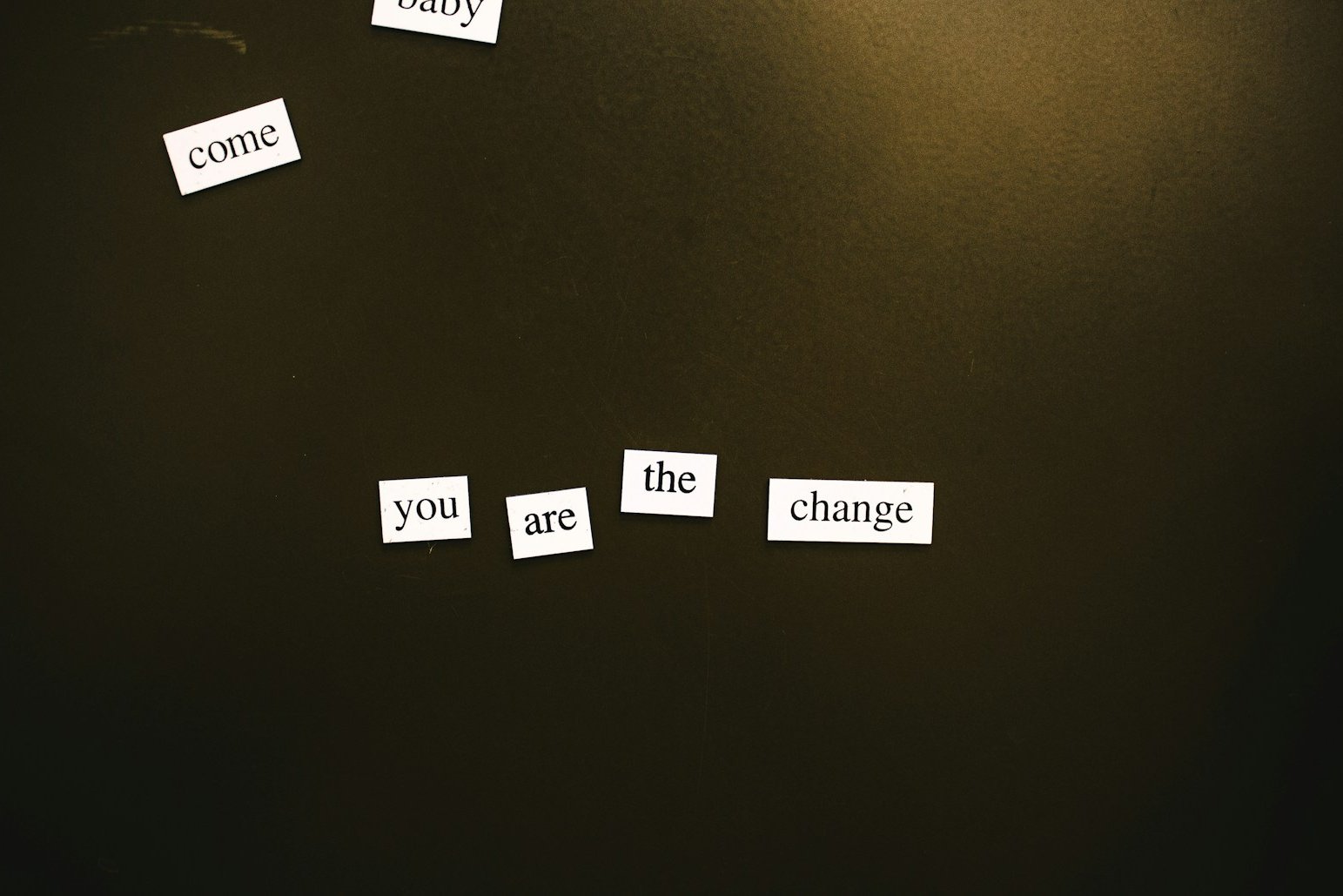 a refrigerator door with magnets that say come, the change, and come