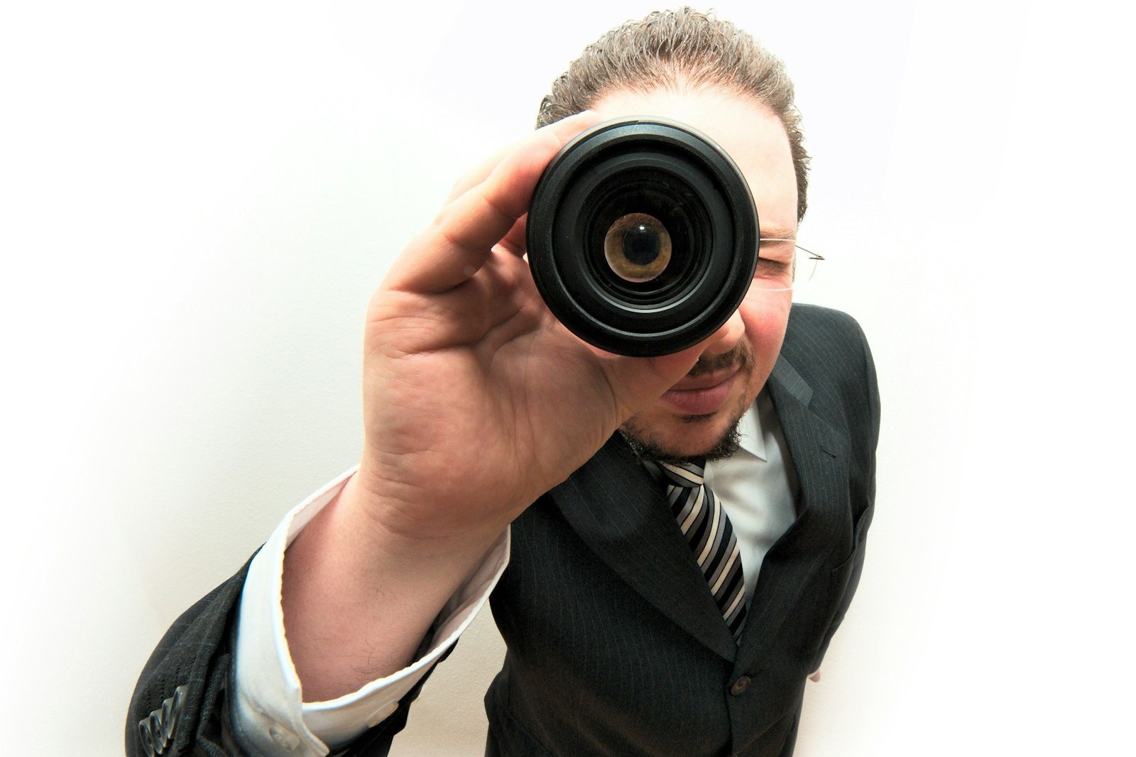 man peeping through monocular