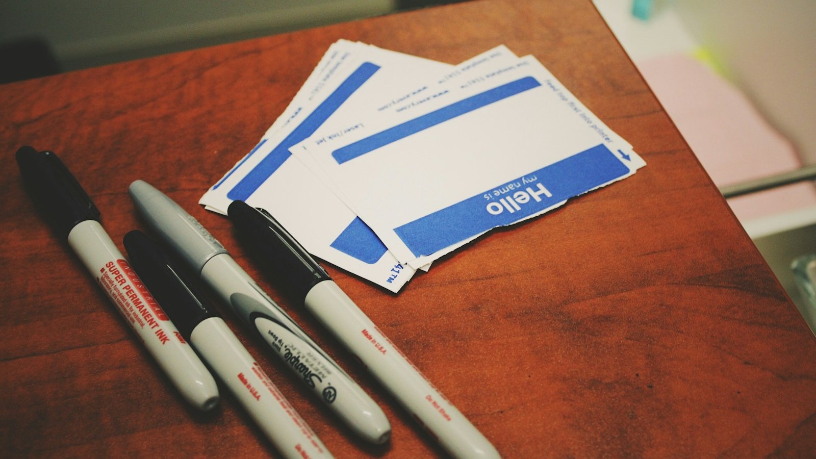 four markers on table