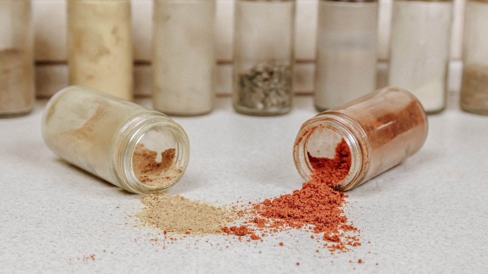 white powder in clear glass jars