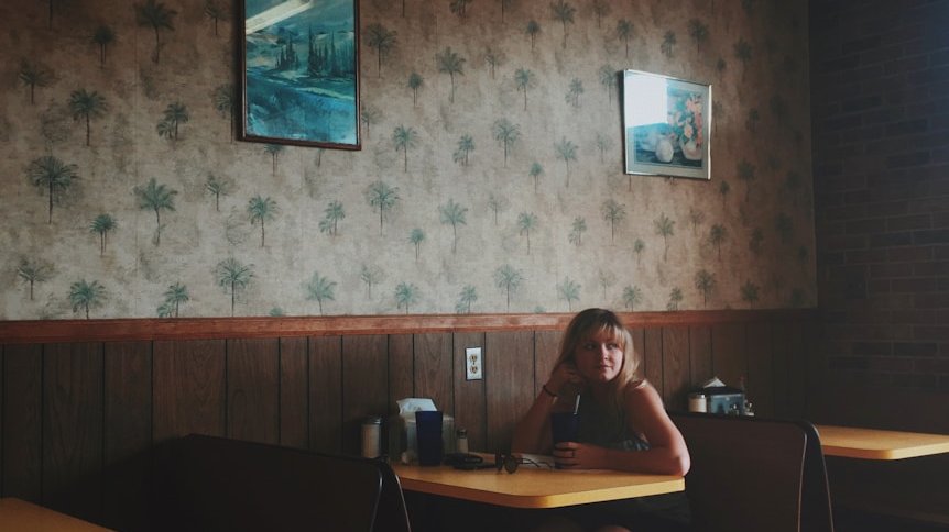woman sitting on restaurant
