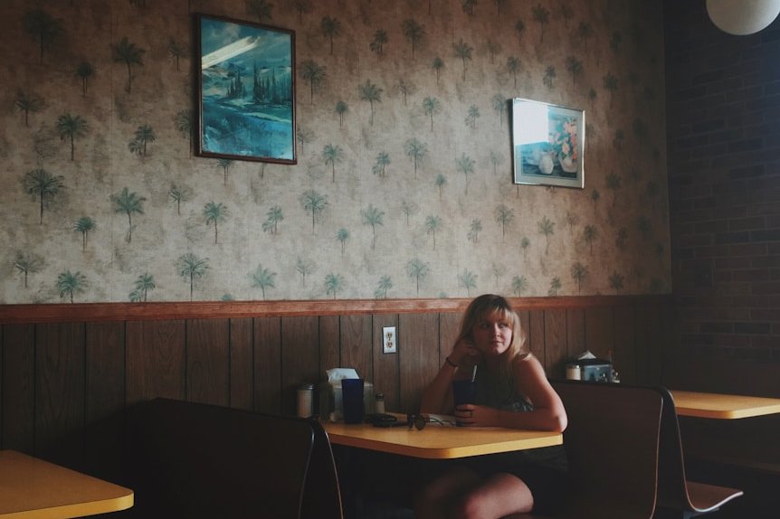 woman sitting on restaurant