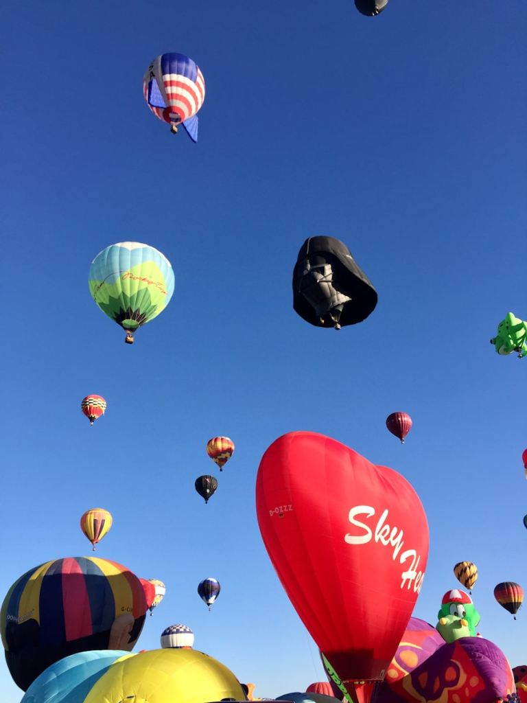 a group of hot air balloons in the sky