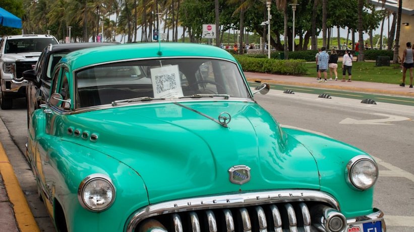 A green car parked on the side of the road